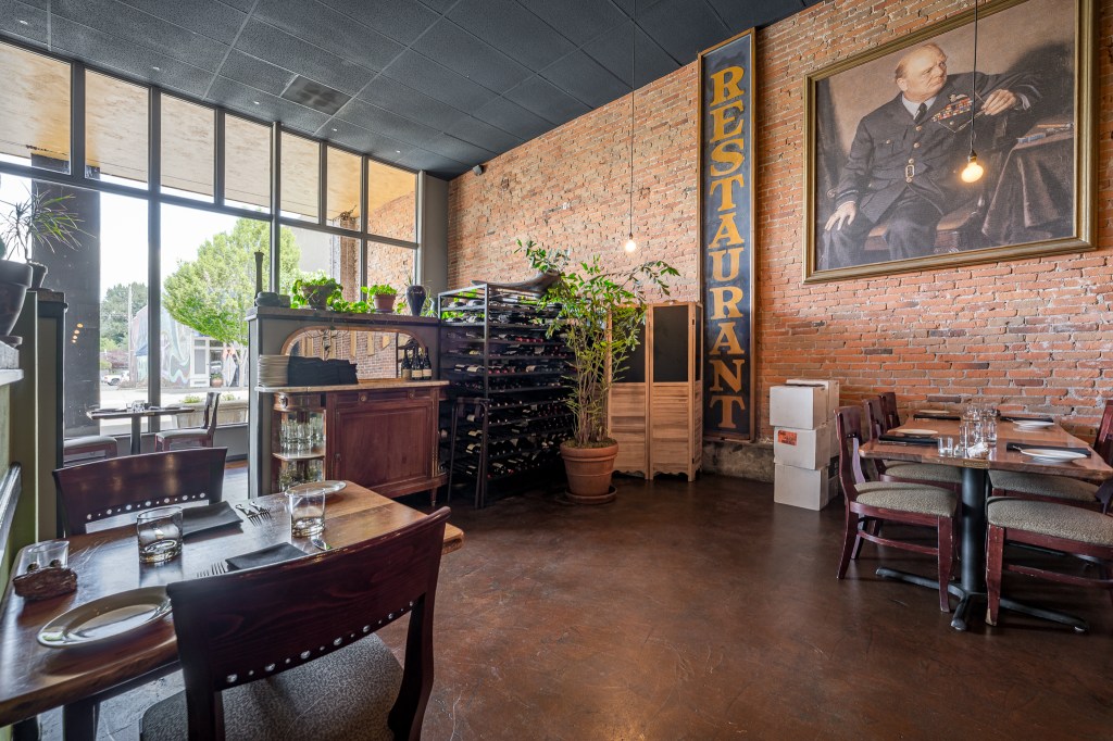Brick walls, large front windows, wine storage cabinets