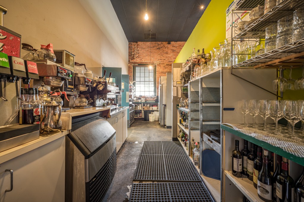 Prep area with storage cabinets and rubber mats on floor