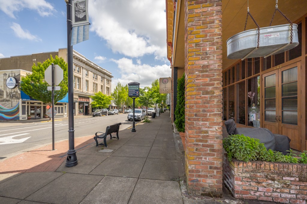 View of street and bench with buildings across the street
