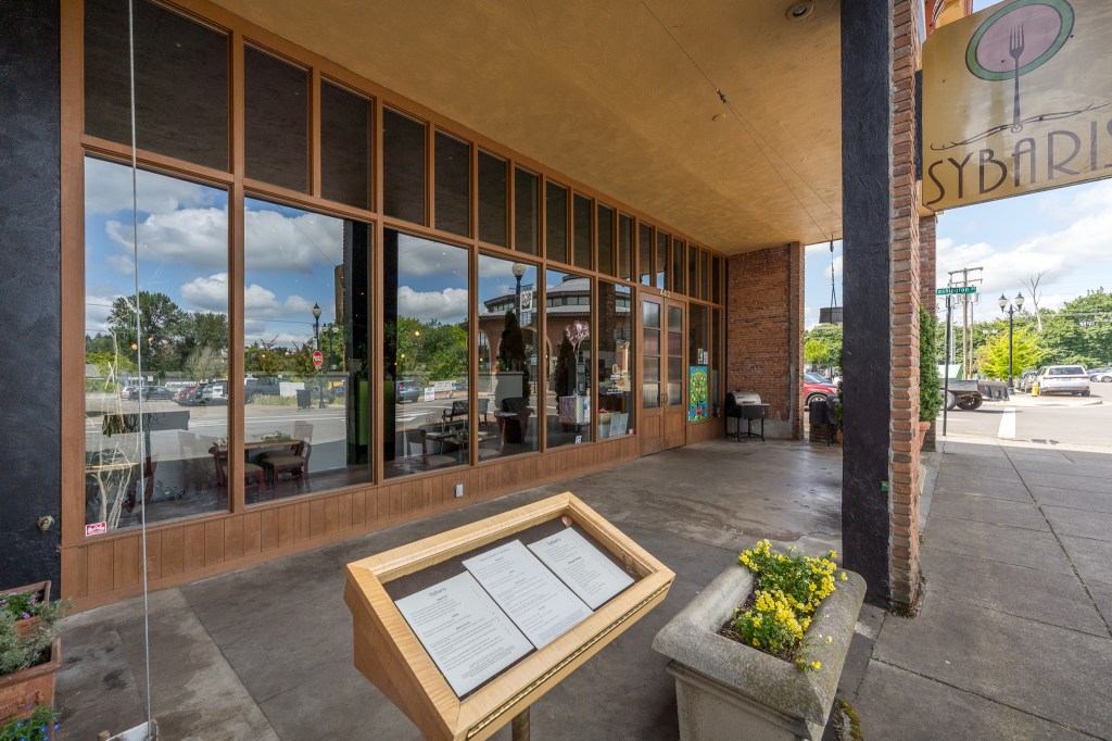 View from the left of covered dining area and menu board